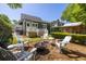 Well-designed backyard with a fire pit and patio area ideal for relaxing and entertaining at 1516 Village Sq, Mount Pleasant, SC 29464