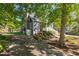 A spacious yard featuring a brick-lined gravel driveway and a well-maintained lawn at 1516 Village Sq, Mount Pleasant, SC 29464