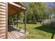 Expansive backyard with covered deck overlooking the water feature and patio at 1516 Village Sq, Mount Pleasant, SC 29464