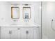 This bathroom has double sinks, stone countertop, and a tiled glass-enclosed shower at 1516 Village Sq, Mount Pleasant, SC 29464