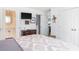 This bedroom has a TV, closet, chest of drawers, and doorway to another room at 1516 Village Sq, Mount Pleasant, SC 29464