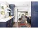 Stylish kitchen with blue and white cabinets with stainless steel appliances and marble countertops at 1516 Village Sq, Mount Pleasant, SC 29464