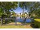 Scenic view of a peaceful pond surrounded by lush greenery and upscale homes at 1516 Village Sq, Mount Pleasant, SC 29464