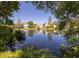 Enjoy a beautiful view of the pond from your home, with a glimpse of the neighborhood beyond the water at 1516 Village Sq, Mount Pleasant, SC 29464