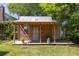 Exterior view of wooden shed featuring a porch and a metal roof at 1516 Village Sq, Mount Pleasant, SC 29464