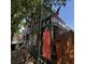 Charming, narrow two-story home with a striking coral door and beautifully textured dark green siding at 152 Coming St St, Charleston, SC 29403