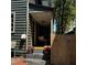 Charming front porch with beautiful flower pots, and wooden fence, creating a private and inviting entrance at 152 Coming St St, Charleston, SC 29403