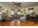 Cozy living room featuring hardwood floors, sectional sofa, and a unique ceiling fan at 152 Coming St St, Charleston, SC 29403