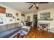 Cozy living room featuring hardwood floors, sectional sofa, fireplace, and dining area at 152 Coming St St, Charleston, SC 29403