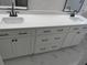 Close-up of bathroom vanity with double sinks, quartz countertop, and modern fixtures at 1527 S Pinebark Ln, Charleston, SC 29407