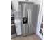 Stainless steel refrigerator with water dispenser and white cabinets at 1527 S Pinebark Ln, Charleston, SC 29407