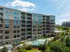 Modern building with a pool deck, balconies, and lush landscaping at 155 Wingo Way # 415, Mount Pleasant, SC 29464