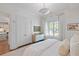 Bright bedroom with white bedding, natural light, and ample closet space creating a cozy retreat at 155 Wingo Way # 415, Mount Pleasant, SC 29464