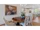 Sophisticated dining area with an elegant table, chandelier, and a view into the bright, modern kitchen at 155 Wingo Way # 415, Mount Pleasant, SC 29464
