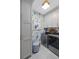 Modern laundry room with cabinetry, wallpaper, and new appliances at 155 Wingo Way # 415, Mount Pleasant, SC 29464