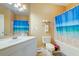 Clean bathroom featuring a vanity, toilet, and a shower with a vibrant ocean-themed curtain at 1832 Telfair Way # 1832, Charleston, SC 29412