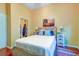 Cozy bedroom featuring warm yellow walls, wood floors, and closet with an open door at 1832 Telfair Way # 1832, Charleston, SC 29412