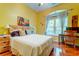 Bright bedroom with a comfortable bed, desk, and a large window with lots of natural light at 1832 Telfair Way # 1832, Charleston, SC 29412