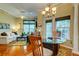 Inviting dining area adjacent to the living room, featuring natural light, hardwood floors, and stylish chandelier at 1832 Telfair Way # 1832, Charleston, SC 29412
