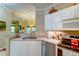 Spacious kitchen with modern appliances and a view to the bright and airy living room at 1832 Telfair Way # 1832, Charleston, SC 29412
