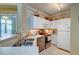 Bright kitchen featuring white cabinets, stainless steel appliances, and tile flooring at 1832 Telfair Way # 1832, Charleston, SC 29412
