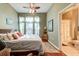 Serene main bedroom with large windows, soft lighting, and an ensuite bathroom for added privacy at 1832 Telfair Way # 1832, Charleston, SC 29412