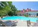 A stunning view of the outdoor pool, featuring ample seating and a bright sunny day at 1832 Telfair Way # 1832, Charleston, SC 29412