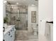 Modern bathroom featuring a glass shower, gray tile, and stylish fixtures at 193 Corn Planters St, Charleston, SC 29492