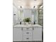 Bathroom with double vanity featuring granite countertops and modern fixtures at 193 Corn Planters St, Charleston, SC 29492