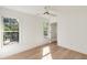 Bedroom with light walls and hardwood floors plus views from the windows at 193 Corn Planters St, Charleston, SC 29492