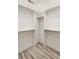 Spacious walk-in closet with built-in shelving and light wood flooring at 193 Corn Planters St, Charleston, SC 29492