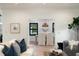 View of the dining room from the living room area, featuring a table and chairs at 193 Corn Planters St, Charleston, SC 29492