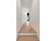 Bright hallway features hardwood floors, white trim, and access to other rooms at 193 Corn Planters St, Charleston, SC 29492