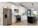 Bright, white kitchen with stainless steel appliances, sleek cabinets, and a functional design at 193 Corn Planters St, Charleston, SC 29492