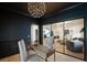Stylish office with dark walls and a view into the living room, enhancing the open feel at 193 Corn Planters St, Charleston, SC 29492