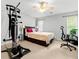 Bedroom features exercise equipment, neutral carpet, and lots of natural light at 2010 Coldspring Dr # 502, North Charleston, SC 29406