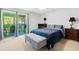 Inviting bedroom with neutral carpet, bench, and access to a screened-in porch at 2010 Coldspring Dr # 502, North Charleston, SC 29406