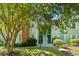 Charming two-story condo with light-green siding, white-trimmed windows, a brick chimney, and well-kept landscaping at 2010 Coldspring Dr # 502, North Charleston, SC 29406