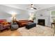 Cozy living room featuring hardwood floors, a fireplace, comfortable seating, natural light, and a ceiling fan at 2010 Coldspring Dr # 502, North Charleston, SC 29406