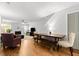 Bright living room with hardwood floors, a dining area, a fireplace, a ceiling fan, and a comfortable seating arrangement at 2010 Coldspring Dr # 502, North Charleston, SC 29406