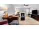 Elegant living room featuring a fireplace, hardwood floors, comfortable seating, and ample natural light at 2010 Coldspring Dr # 502, North Charleston, SC 29406