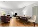 Bright living room with hardwood floors, a dining area, a fireplace, a ceiling fan, and a comfortable seating arrangement at 2010 Coldspring Dr # 502, North Charleston, SC 29406