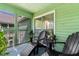 Relaxing screened-in porch with seating area and wooded views at 2010 Coldspring Dr # 502, North Charleston, SC 29406