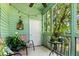 Enclosed back porch, brightly painted, with comfortable seating and natural light at 2010 Coldspring Dr # 502, North Charleston, SC 29406