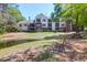 Apartment building with well-maintained landscaping and pond view from shaded bench seating area at 2011 N Highway 17 # 1400T, Mount Pleasant, SC 29466
