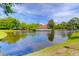 Scenic pond view showcasing a gazebo, with lush trees, blue skies, and verdant landscapes at 2011 N Highway 17 # 1400T, Mount Pleasant, SC 29466