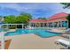 Community pool surrounded by lounge chairs and tables; perfect for relaxation or socializing at 2011 N Highway 17 # 1400T, Mount Pleasant, SC 29466