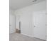 Bedroom with carpet flooring, white walls, and a view into the hallway at 202 W Bradford Pointe Drive Dr, Summerville, SC 29483