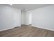 Large, open living area with light wood floors, white walls, and views of multiple doorways at 202 W Bradford Pointe Drive Dr, Summerville, SC 29483