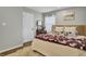 Cozy bedroom with hardwood floors, area rug, neutral color palette, and a large bed at 210 Peters St, Summerville, SC 29483